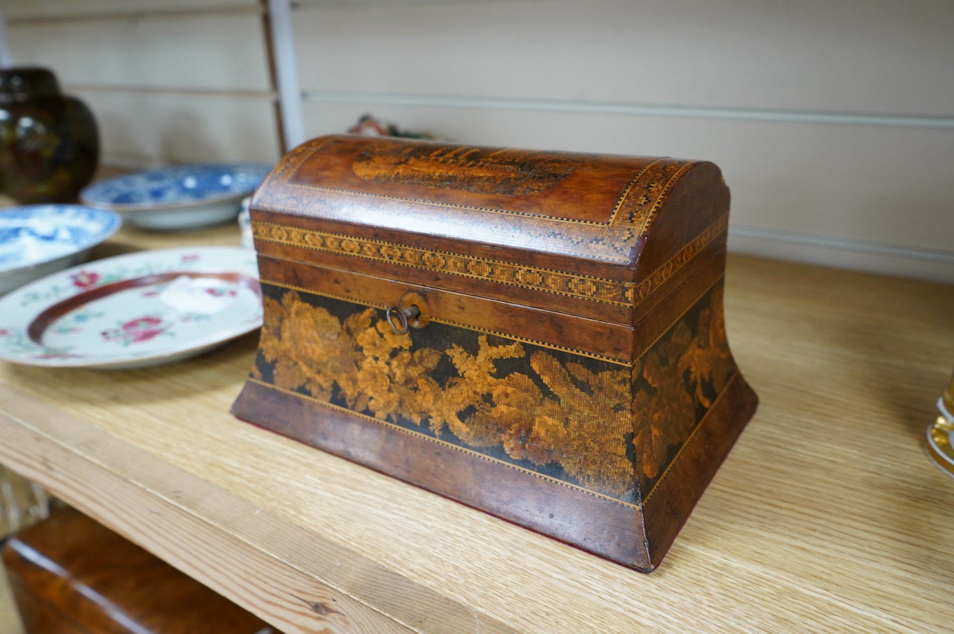 A Tunbridgeware box of domed form, with a scene of an Abbey ruins, 25cm wide